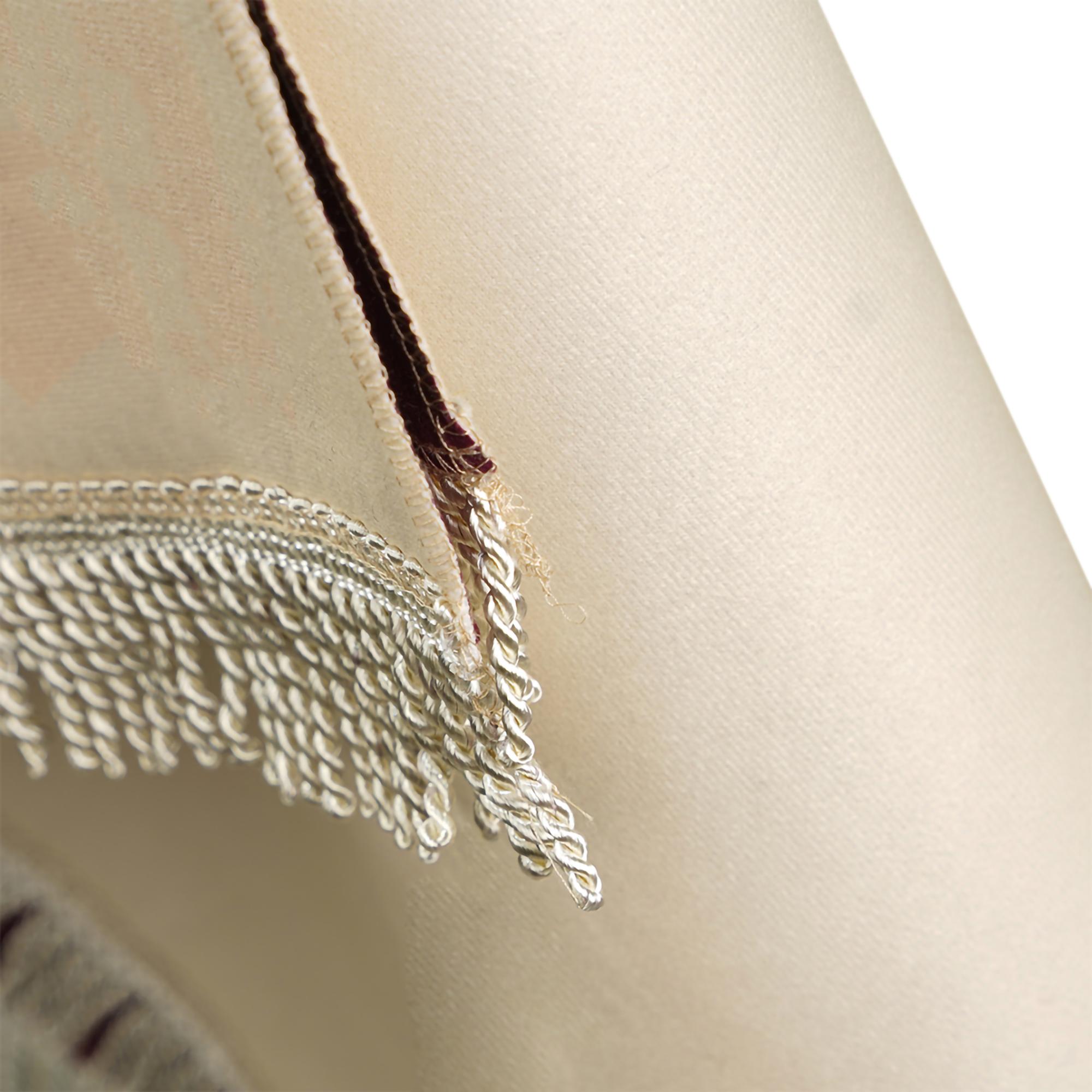 Delicate embroidered cuff close-up